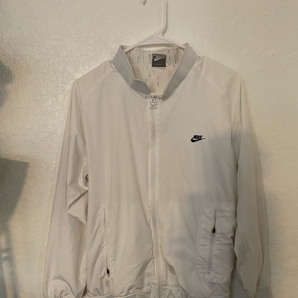 White Nike jacket.